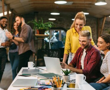 young web designers working together at modern office 1199690908 b20452b370ef4a36873d2b62fbd244c1 1