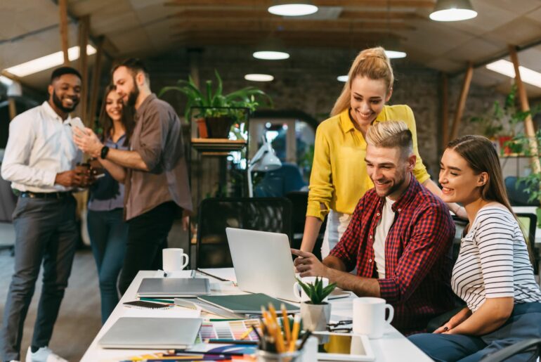 young web designers working together at modern office 1199690908 b20452b370ef4a36873d2b62fbd244c1 1