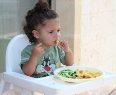 child eating food