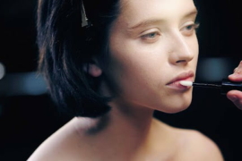 lady applying lip balm