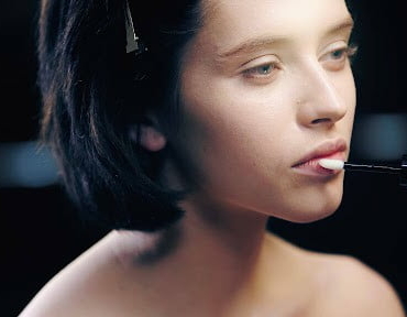 lady applying lip balm