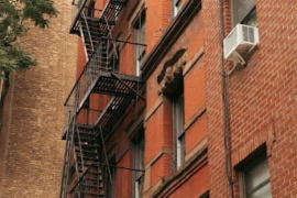 tall building red fire escape
