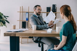 boss with contract at office