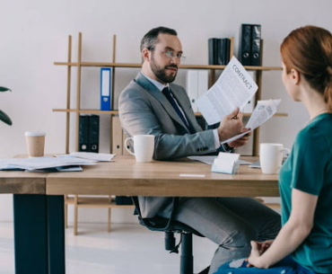 boss with contract at office