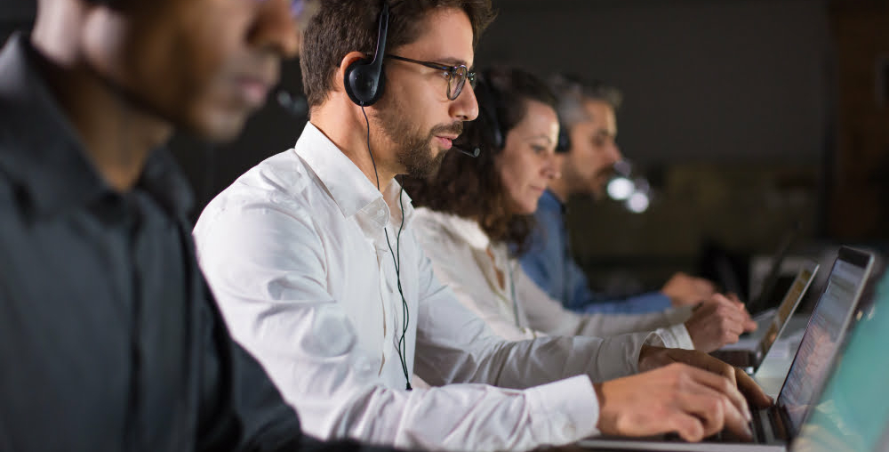confident-call-center-operator-talking-with-client