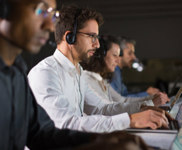 confident-call-center-operator-talking-with-client