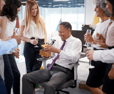 man receiving gifts in office