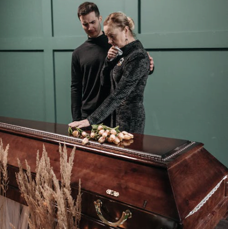 people crying on funeral