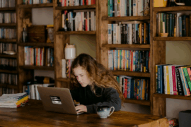 girl using laptop in library
